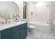 Charming bathroom with a stylish vanity, marble countertops, and gold fixtures at 1214 S Kings Dr # A, Charlotte, NC 28207
