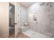 Spa-like shower with marble tile and built-in shelves at 1214 S Kings Dr # A, Charlotte, NC 28207