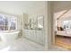 Elegant bathroom with freestanding tub, double vanity, and marble flooring at 1214 S Kings Dr # A, Charlotte, NC 28207
