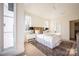 Well-lit bedroom with window seat and carpet flooring at 1214 S Kings Dr # A, Charlotte, NC 28207