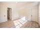 Bright bedroom with hardwood floors and access to a bathroom at 1214 S Kings Dr # A, Charlotte, NC 28207