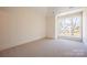 Spacious bedroom with large windows and carpet flooring at 1214 S Kings Dr # A, Charlotte, NC 28207
