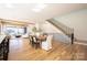 Open dining room with hardwood floors and view of living room at 1214 S Kings Dr # A, Charlotte, NC 28207