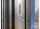 Modern elevator featuring a sleek design and decorative paneling, providing convenient access to multiple floors at 1214 S Kings Dr # A, Charlotte, NC 28207
