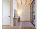 Light and airy entryway with wood floors and built-in bench at 1214 S Kings Dr # A, Charlotte, NC 28207