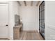 Stylish entryway with wooden floors, a console table, and a modern front door with glass panels at 1214 S Kings Dr # A, Charlotte, NC 28207
