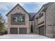 Stately brick home with a three-car garage, elegant windows, and well-maintained landscaping at 1214 S Kings Dr # A, Charlotte, NC 28207