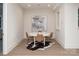 Recreational room with a round table, chairs, and an artistic painting on the wall at 1214 S Kings Dr # A, Charlotte, NC 28207