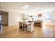 Modern kitchen with island, hardwood floors, and breakfast area at 1214 S Kings Dr # A, Charlotte, NC 28207