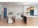 Bright kitchen with eat in island, stainless steel appliances and an open dining area at 1214 S Kings Dr # A, Charlotte, NC 28207