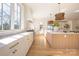 Bright and airy kitchen with a large center island, custom cabinetry, and high-end appliances at 1214 S Kings Dr # A, Charlotte, NC 28207
