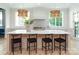 Bright, modern kitchen features a large island, sleek countertops, and stylish pendant lighting at 1214 S Kings Dr # A, Charlotte, NC 28207
