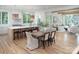 Open-concept kitchen and dining area with quartz countertops, a large island, and hardwood floors at 1214 S Kings Dr # A, Charlotte, NC 28207
