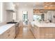 Spacious kitchen features stainless steel appliances, quartz countertops, a large island, and eat in area at 1214 S Kings Dr # A, Charlotte, NC 28207