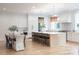 Spacious kitchen and dining area with bar seating, hardwood floors and stainless appliances at 1214 S Kings Dr # A, Charlotte, NC 28207