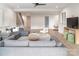 Open-concept living room with hardwood floors, recessed lighting, and modern gray sofa at 1214 S Kings Dr # A, Charlotte, NC 28207