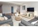 Spacious living room featuring a large sectional, stylish rug, and a view to dining area at 1214 S Kings Dr # A, Charlotte, NC 28207