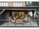 Spacious covered patio with fireplace and comfortable seating, perfect for outdoor entertaining at 1214 S Kings Dr # A, Charlotte, NC 28207