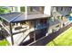 Multi-level patio with comfortable seating, a covered dining area, and backyard views at 1214 S Kings Dr # A, Charlotte, NC 28207