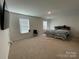 Primary bedroom with plush carpet and plenty of natural light at 141 Hayes Rd, Kings Mountain, NC 28086