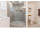 Modern tiled bathroom with a glass shower and built-in shelves for a clean and organized space at 14450 Maritime Dr, Lancaster, SC 29720