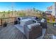Outdoor deck featuring comfortable seating, perfect for enjoying the surrounding wooded views at 14450 Maritime Dr, Lancaster, SC 29720