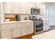 Bright kitchen features white cabinets, stainless steel appliances, and subway tile backsplash at 14450 Maritime Dr, Lancaster, SC 29720
