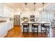 Well-lit kitchen featuring an island with seating, stainless steel appliances, and white cabinetry at 14450 Maritime Dr, Lancaster, SC 29720