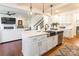 Open kitchen with a large island, stainless steel appliances, and hardwood floors at 14450 Maritime Dr, Lancaster, SC 29720
