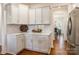 Kitchen with white cabinets, stainless steel refrigerator, and view to adjacent dining area at 14450 Maritime Dr, Lancaster, SC 29720