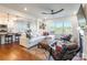 Stylish living room with hardwood floors and modern furnishings adjacent to kitchen at 14450 Maritime Dr, Lancaster, SC 29720