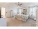 Spacious main bedroom boasts large windows, ceiling fan, and neutral decor at 14450 Maritime Dr, Lancaster, SC 29720