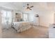 Spacious main bedroom boasts large windows, ceiling fan, and neutral decor at 14450 Maritime Dr, Lancaster, SC 29720