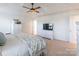Carpeted Main bedroom with large window, ceiling fan, dresser and neutral decor at 14450 Maritime Dr, Lancaster, SC 29720