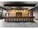 Chic bar featuring a brick wall, sleek pendants, and stylish modern bar stools at 1565 Shinnville Rd, Cleveland, NC 27013