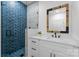 Beautiful bathroom featuring a glass shower, modern tile, and white vanity at 1565 Shinnville Rd, Cleveland, NC 27013