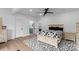 Well-lit bedroom featuring a black ceiling fan and a stylish cow print rug at 1565 Shinnville Rd, Cleveland, NC 27013