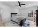 Cozy bedroom with a black ceiling fan and lots of natural light at 1565 Shinnville Rd, Cleveland, NC 27013
