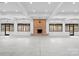 A large, sunlit hall features a striking brick fireplace and uniform recessed lighting at 1565 Shinnville Rd, Cleveland, NC 27013