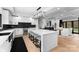 Open kitchen with a large island and seating that flows into the dining and living area at 1565 Shinnville Rd, Cleveland, NC 27013