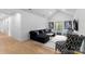 Bright living room featuring elegant decor, dark modern seating, and hardwood floors at 1575 Shinnville Rd, Cleveland, NC 27013