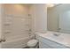 Well-lit bathroom featuring white fixtures, a shower-tub combo, and single vanity at 1630 Troon Dr, Salisbury, NC 28144
