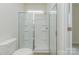 Modern bathroom with a glass-enclosed shower, white tile, and a new toilet at 1630 Troon Dr, Salisbury, NC 28144