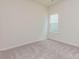 Neutral bedroom featuring plush carpet, a window, and light colored walls at 1630 Troon Dr, Salisbury, NC 28144