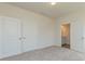 Comfortable bedroom with two closets, carpet, and a door leading to the ensuite bathroom at 1630 Troon Dr, Salisbury, NC 28144