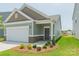 Inviting single-story home featuring a covered entryway and well-maintained lawn at 1630 Troon Dr, Salisbury, NC 28144