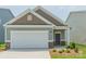 Charming single-story home with a two-car garage and beautifully landscaped front yard at 1630 Troon Dr, Salisbury, NC 28144