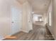 Inviting hallway with durable wood-look floors, leading to an open-concept area with a kitchen and counter seating at 1630 Troon Dr, Salisbury, NC 28144