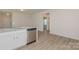Bright kitchen with white cabinets, stainless appliances, and an open layout at 1630 Troon Dr, Salisbury, NC 28144