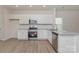 Well-equipped kitchen featuring white cabinets, stainless steel appliances, and stylish finishes at 1630 Troon Dr, Salisbury, NC 28144